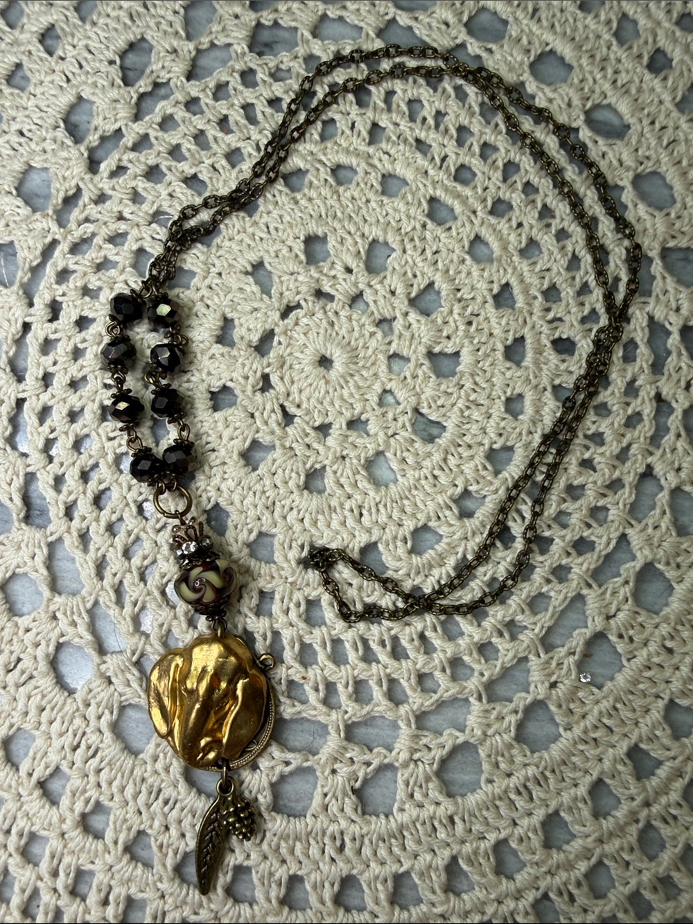 Gold and Black Pendant Necklace with Leaf Charm